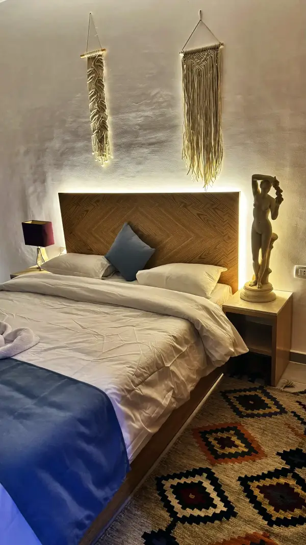 Main bedroom with woven wall hangings