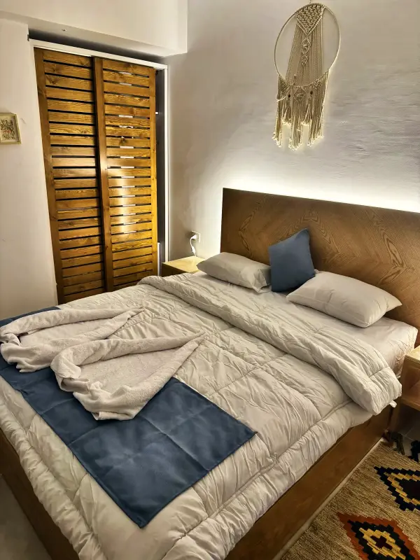 Double bedroom with shuttered wardrobe