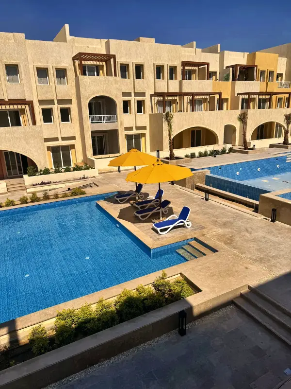 The main pool with the apartment buildings around it