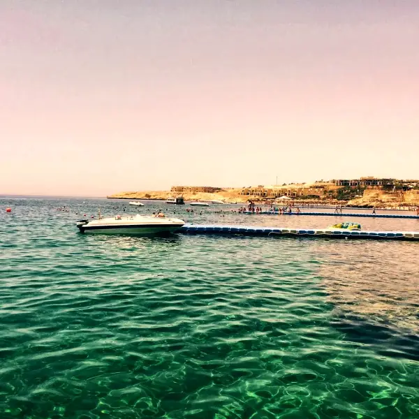 Turquoise water over the shallows by the jetty